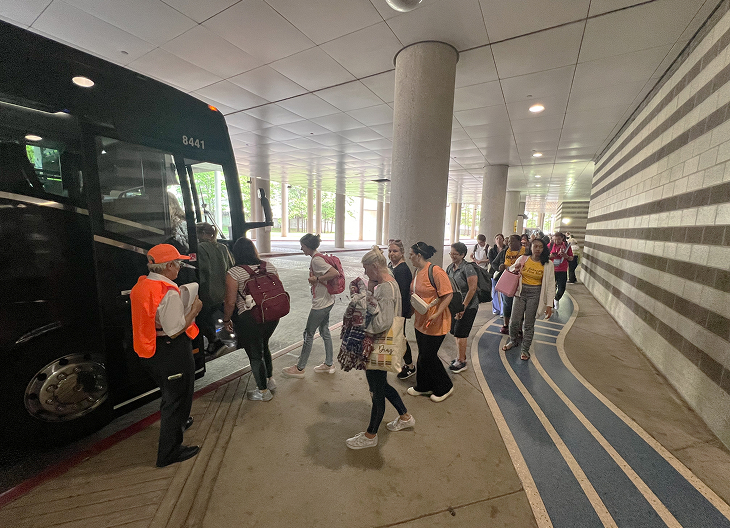 ECHO AFC charter bus dropping off a sports team at Choctaw Stadium in Arlington, TX